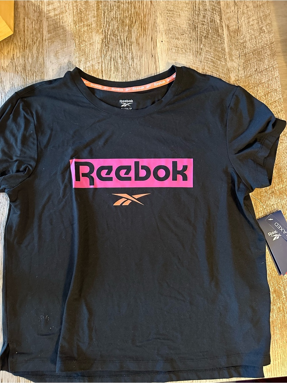 Reebok Black Tee with Pink Logo and Orange Accent